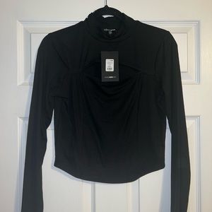 Top with the chest area open. From FASHION NOVA